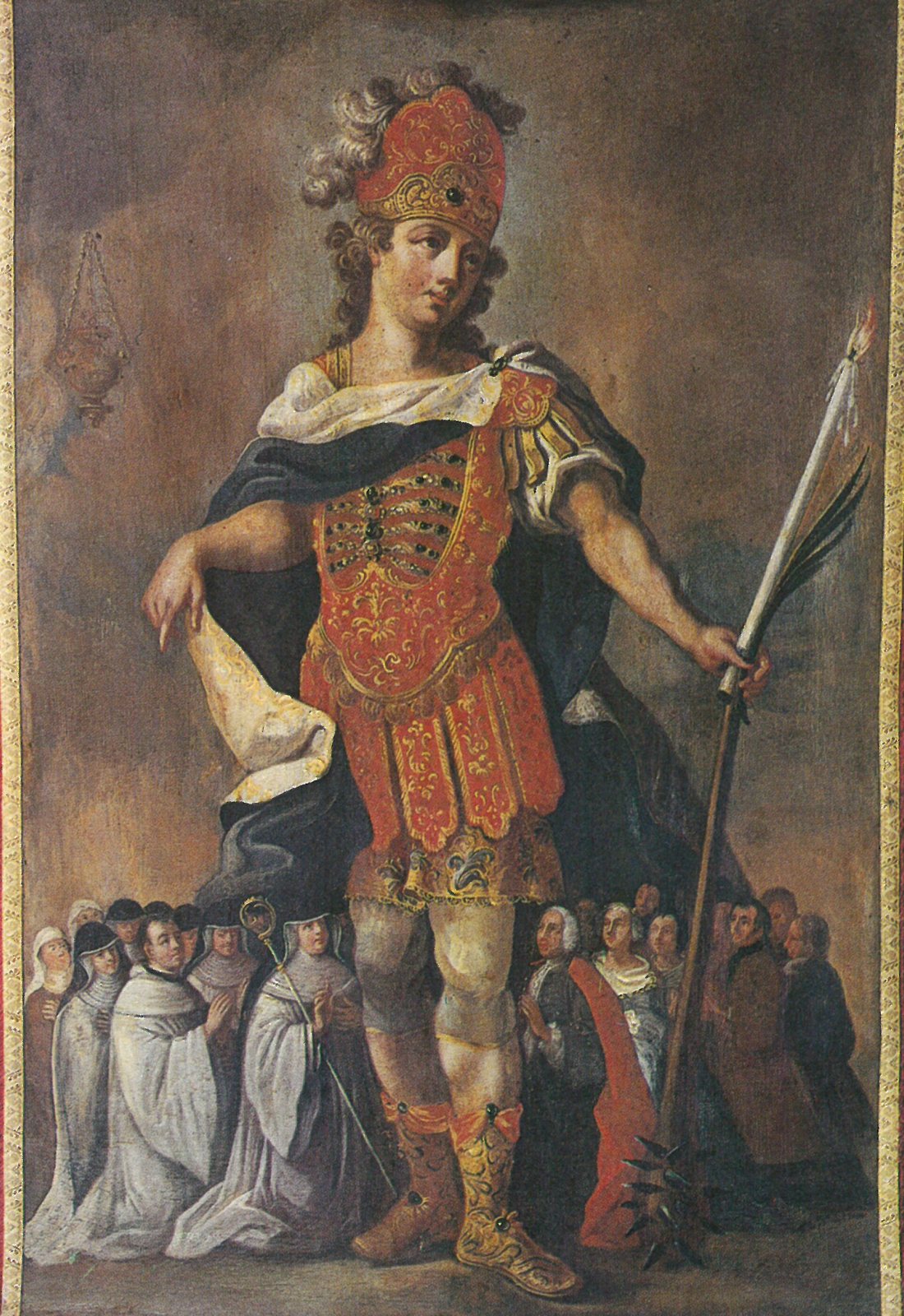 A painted banner of a young saint in Roman armor, a red plumed helmet and a dark cloak, holding a long martyr's palm, with white-robed nuns and townspeople gathered small at his feet