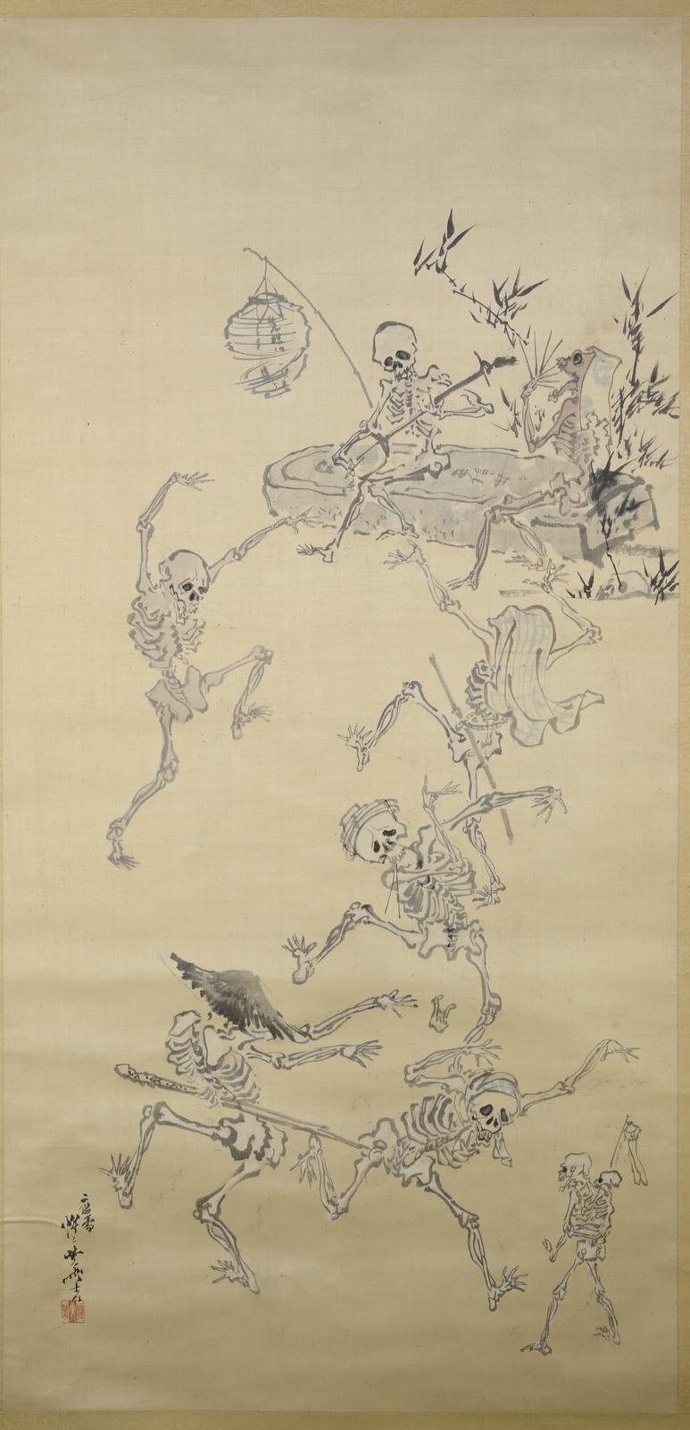 A tall hanging scroll of ink skeletons dancing in a loose line, one seated playing a shamisen beneath a paper lantern while others kick and wave