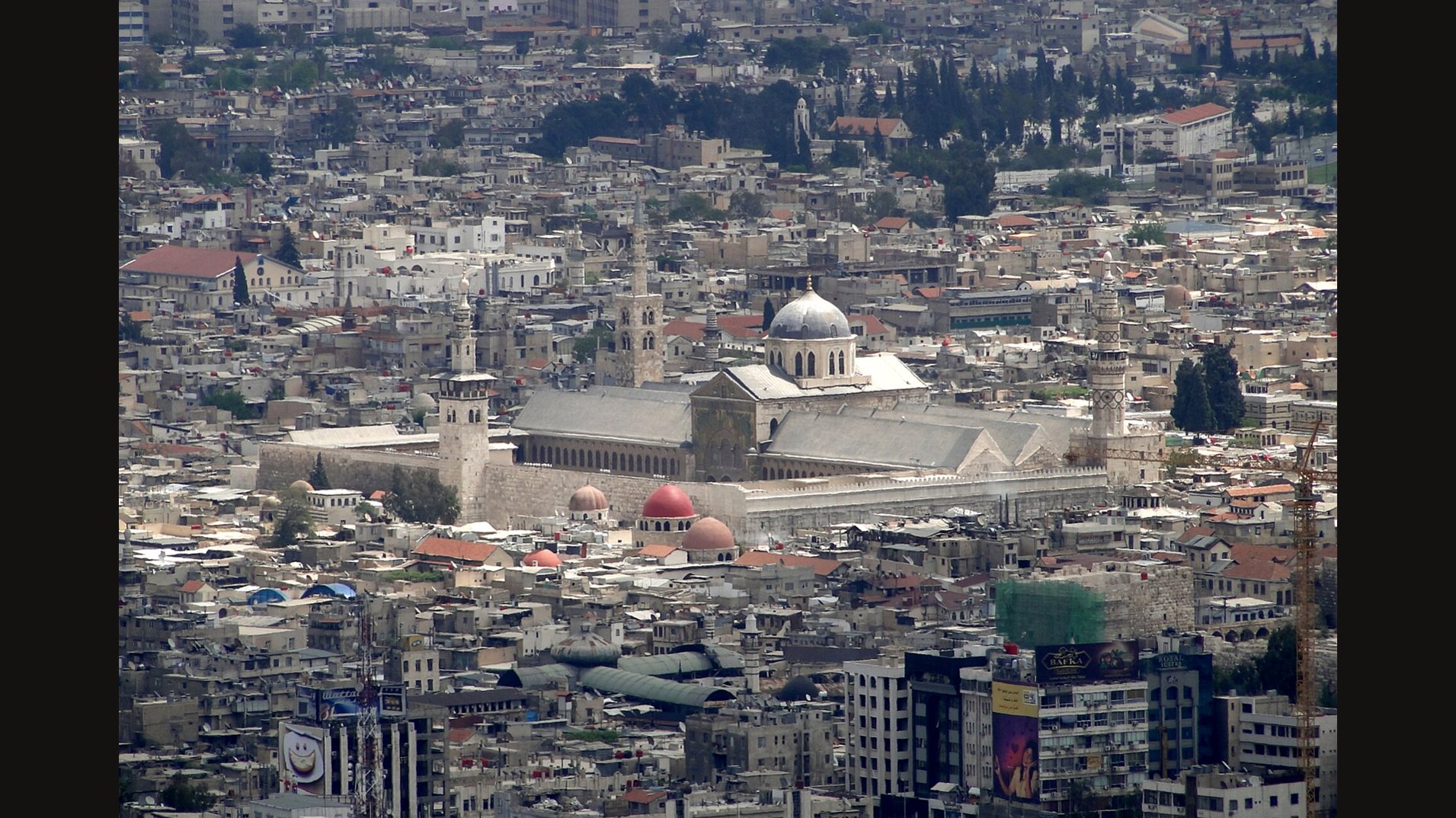 The Umayyad Mosque rising above the crowded rooftops of Damascus, with its domes and minarets