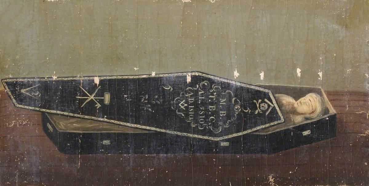 Worn painted board showing a black coffin with its lid partly open: the lid carries Masonic emblems, dates of 1810, a sprig of acacia and a small skull and crossbones, and a pale painted figure lies inside