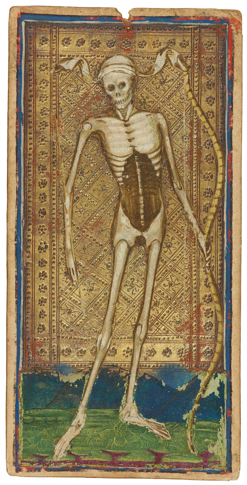 A hand-painted tarot card showing a thin, long-legged skeleton with a cloth tied around its skull, standing on a strip of green ground against a gold background patterned with small flowers