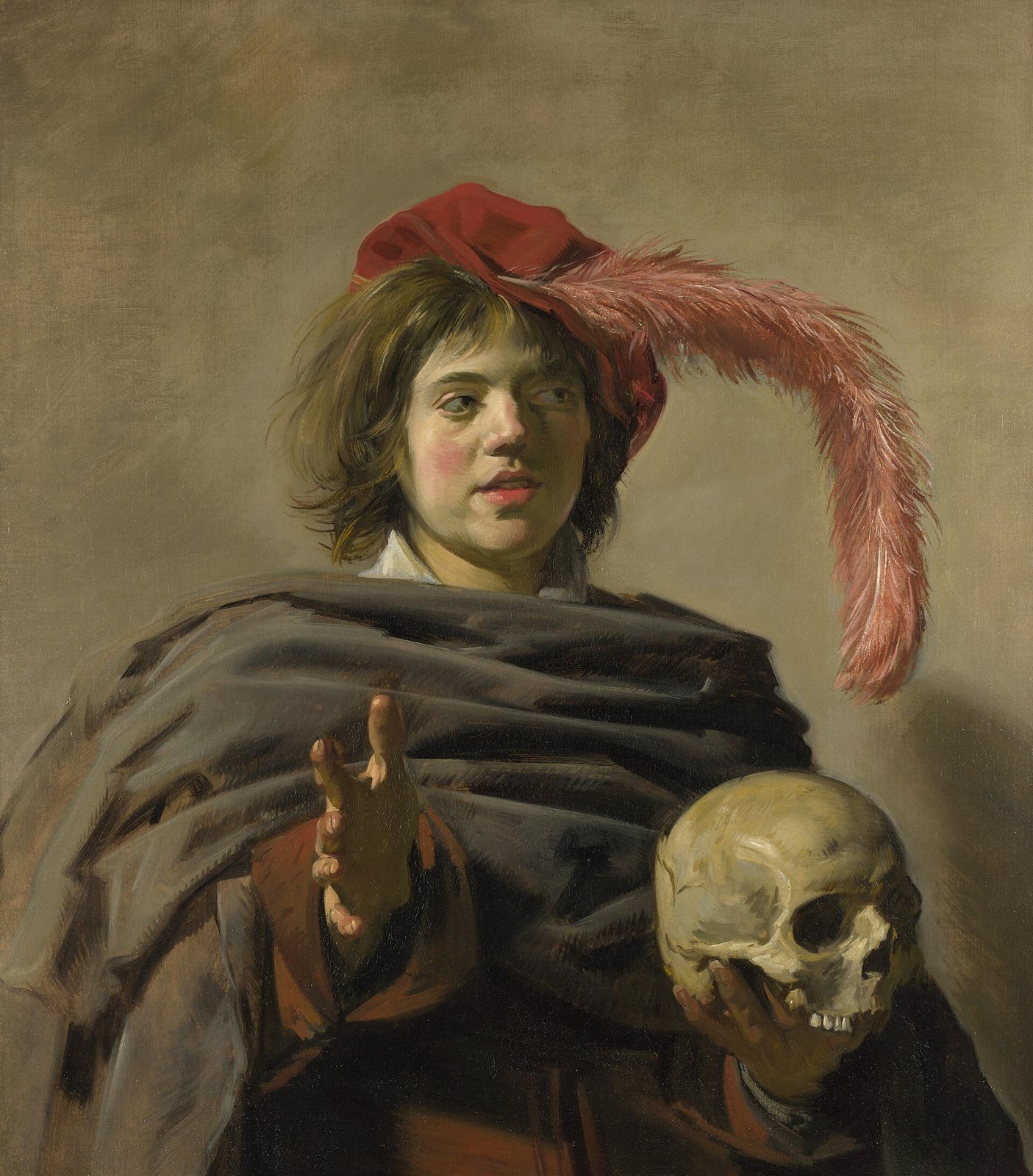 Pintura de Frans Hals de un joven con gorro rojo con pluma y capa oscura, que sostiene una calavera en una mano y extiende la otra hacia quien mira