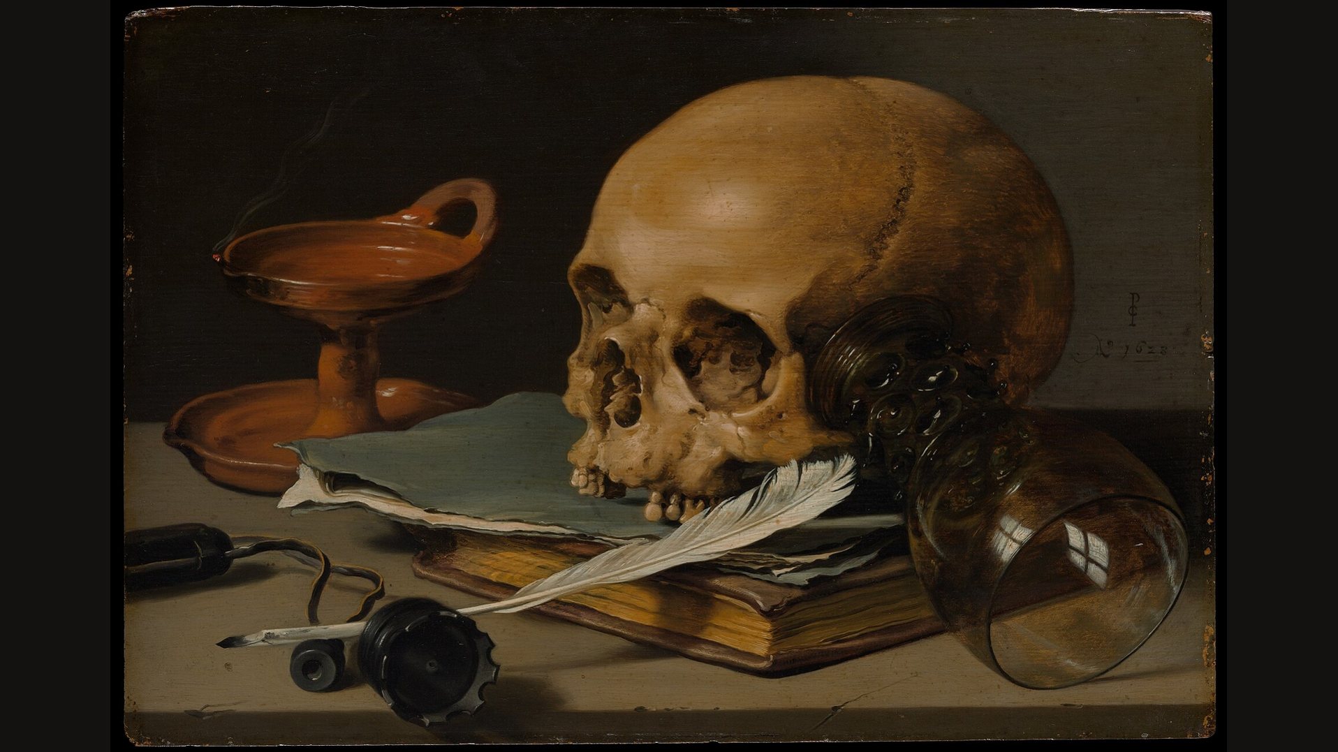 Pieter Claesz's still life: a pale skull rests on papers and a book with a white quill, beside a toppled glass and a shallow brass lamp, against a dark ground